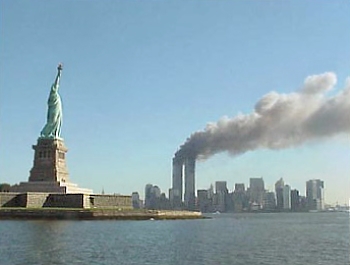 National_Park_Service_9-11_Statue_of_Liberty_and_WTC_fire.jpg